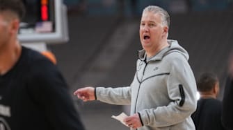 Purdue head coach Matt Painter instructs his team during practice 