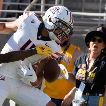 Arizona State defensive back Shamari Simmons (7) defends a pass against Arizona wide receiver Tetairoa McMillan (4) during the first quarter at Mountain America Stadium in Tempe on Nov. 25, 2023.