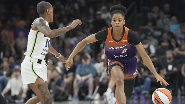 Phoenix Mercury guard Monique Akoa Makani (8) is defended by Minnesota Lynx guard Courtney Williams (10) during the first quarter at PHX Arena on July 9, 2025.