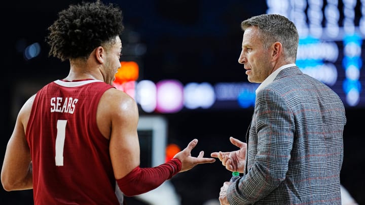Alabama guard Mark Sears (1) talks with head coach Nate Oats during the Final Four semifinal game against Connecticut at State Farm Stadium.