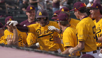 Arizona State catcher Josiah Cromwick (21) is congratulated after a solo home run against Ohio State during the first inning at Phoenix Municipal Stadium on Feb. 16, 2025.