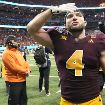 Arizona State running back Cam Skattebo (4) blows a kiss toward fans after Texas won 39-31 in double overtime in the Chick-fil-A Peach Bowl in Atlanta on Jan. 1, 2025.
