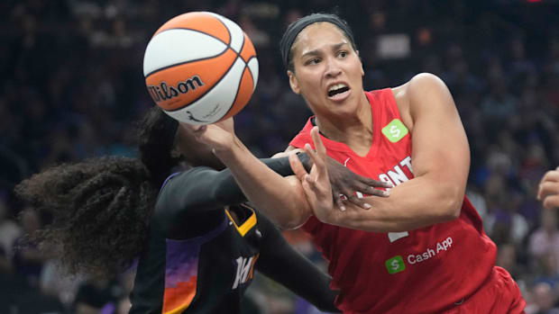 A photo of Brionna Jones throwing a pass