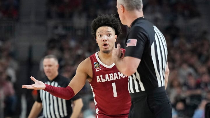 Alabama guard Mark Sears (1) questions a play during the Final Four semifinal game against Connecticut at State Farm Stadium.