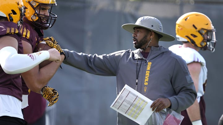 Arizona State Sun Devils WR coach/passing game coordinator Ra'Shaad Samples instructs his players during spring football practice at the Kajikawa practice fields in Tempe on March 16, 2023.

Ncaa Football Asu Spring Football Practice