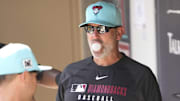 Arizona Diamondbacks manager Torey Lovullo blows a bubble during a spring training game against the Cleveland Guardians at Salt River Fields on Feb. 24, 2025.