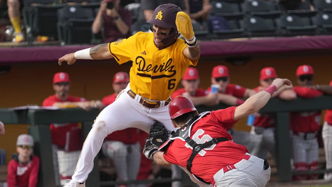 Arizona State infielder Nu'u Contrades (6) is tagged out by Ohio State catcher Mason Eckelman (16) at home during the fifth inning at Phoenix Municipal Stadium on Feb. 16, 2025.