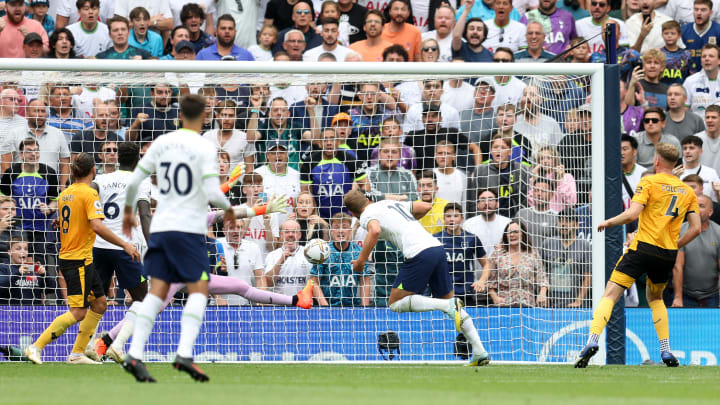 Harry Kane stoops to give Tottenham the lead against Wolves