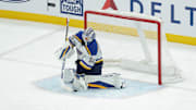 Feb 2, 2025; Salt Lake City, Utah, USA; St. Louis Blues goaltender Jordan Binnington (50) makes a save with his glove during the third period against the Utah Hockey Club at Delta Center. Mandatory Credit: Chris Nicoll-Imagn Images