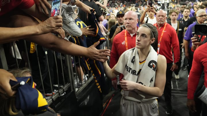 Indiana Fever guard Caitlin Clark (22) signs autographs for fans 