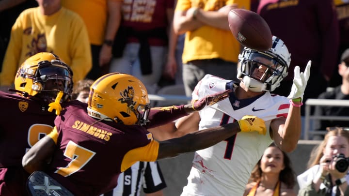 Arizona State defensive back Shamari Simmons (7) defends a pass against Arizona wide receiver Tetairoa McMillan (4) during the first quarter at Mountain America Stadium in Tempe on Nov. 25, 2023.