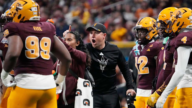 Arizona State head coach Kenny Dillingham talks to his team during the first quarter against Texas of the Chick-fil-A Peach B