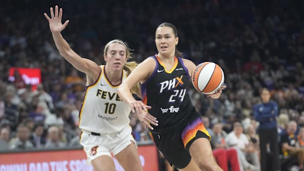 A photo of Kathryn Wetsbeld driving past Lexie Hul