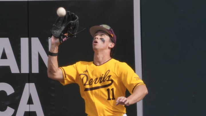 Arizona State outfielder Kien Vu makes a catch against Ohio State at Phoenix Municipal Stadium on Sunday, Feb. 16, 2025.