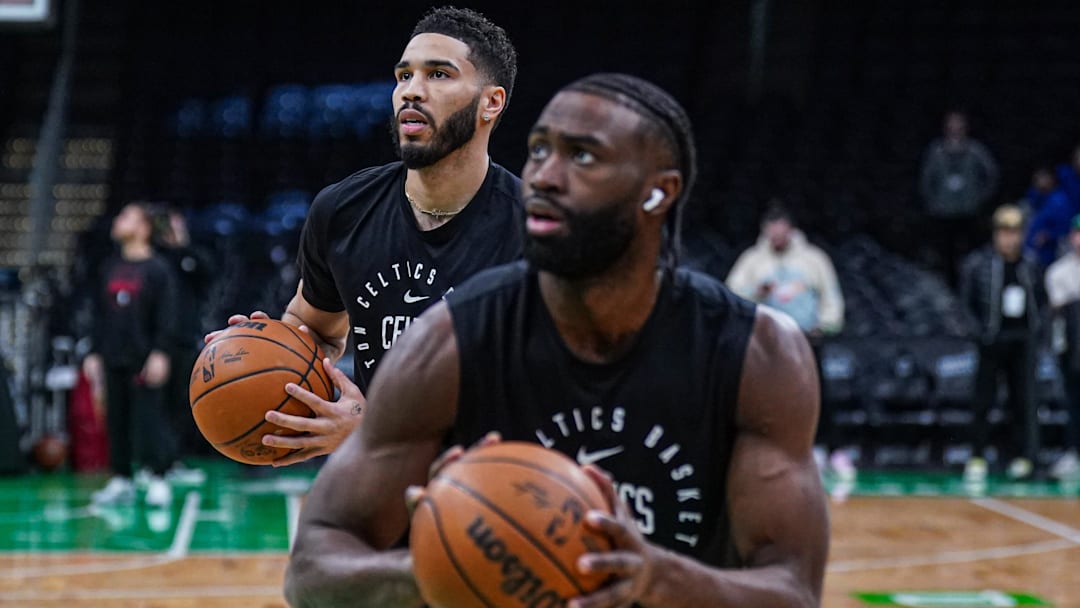 Jan 27, 2025; Boston, Massachusetts, USA; Boston Celtics forward Jayson Tatum (0) and guard Jaylen Brown (7) warm up before the start of the game against the Houston Rockets at TD Garden.