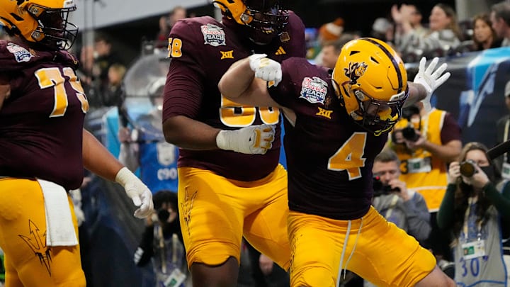 Arizona State running back Cam Skattebo (4) celebrates after a touchdown against Texas during the fourth quarter in the Chick-fil-A Peach Bowl in Atlanta on Wednesday, Jan. 1, 2025. Arizona State running back Cam Skattebo (4) celebrates after a touchdown against Texas during the fourth quarter in the Chick-fil-A Peach Bowl in Atlanta on Wednesday, Jan. 1, 2025.