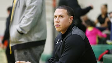 Shadow Mountain head coach Mike Bibby watches his team warm up against St. Mary’s at the St. Mary's High School gym in Phoenix on Jan. 24, 2017.
