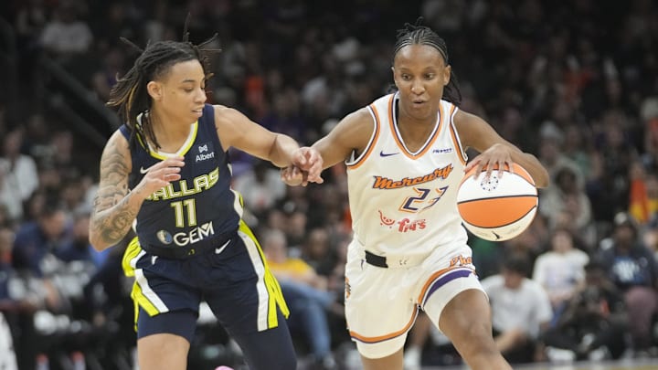 Phoenix Mercury guard Kiana Williams (23) is defended by Dallas Wings guard JJ Quinerly (11) during the third quarter at PHX Arena on July 7, 2025. Phoenix Mercury guard Kiana Williams (23) is defended by Dallas Wings guard JJ Quinerly (11) during the third quarter at PHX Arena on July 7, 2025.