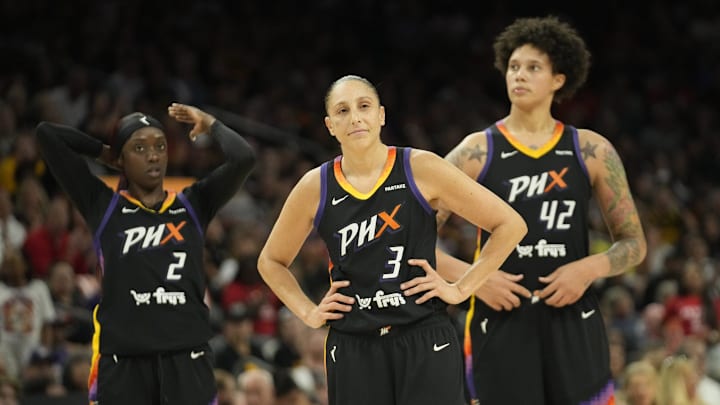 Phoenix Mercury guards Kahleah Copper (2) and Diana Taurasi (3) and center Brittney Griner.