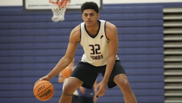 Perry's Koa Peat warms up during practice at Perry High School gym in Gilbert