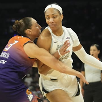 Phoenix Mercury guard Diana Taurasi defends against Las Vegas Aces center A'ja Wilson 