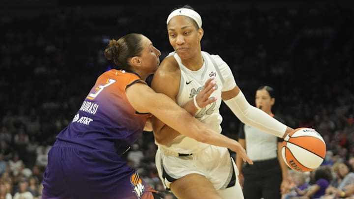 Phoenix Mercury guard Diana Taurasi defends against Las Vegas Aces center A'ja Wilson 