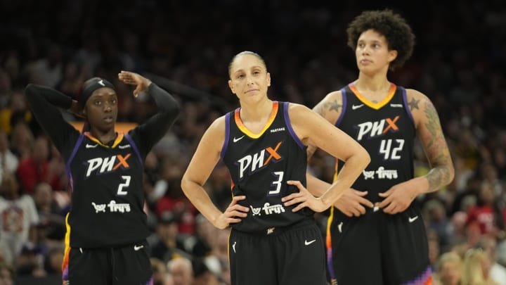 Phoenix Mercury guards Kahleah Copper (2) and Diana Taurasi (3) and center Brittney Griner.