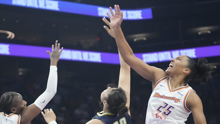 Phoenix Mercury forward Alyssa Thomas (25) grabs a rebound from Dallas Wings center Li Yueru (28) during the first quarter at PHX Arena on July 7, 2025. Phoenix Mercury forward Alyssa Thomas (25) grabs a rebound from Dallas Wings center Li Yueru (28) during the first quarter at PHX Arena on July 7, 2025.
