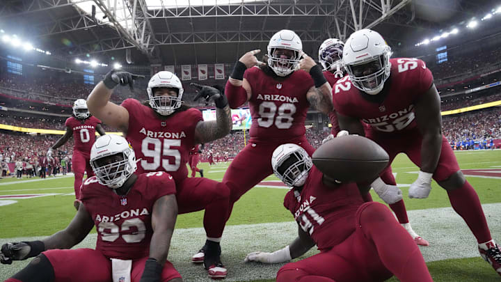 Arizona Cardinals defensive end L.J. Collier (91) celebrates his fumble recovery with teammates against the Los Angeles Rams during the fourth quarter at State Farm Stadium.