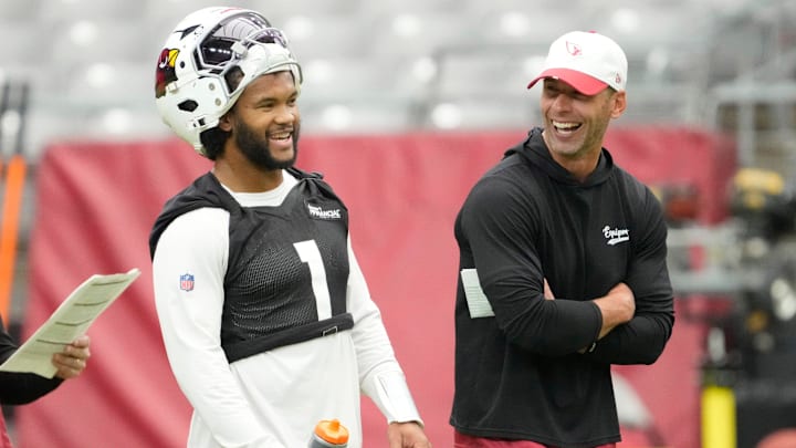 Arizona Cardinals quarterback Kyler Murray and head coach Jonathan Gannon share a laugh during training camp