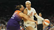 Phoenix Mercury guard Diana Taurasi defends against Wilson during the first quarter at Footprint Center.