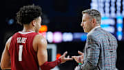 Alabama guard Mark Sears (1) talks with head coach Nate Oats during the Final Four semifinal game against Connecticut at State Farm Stadium.