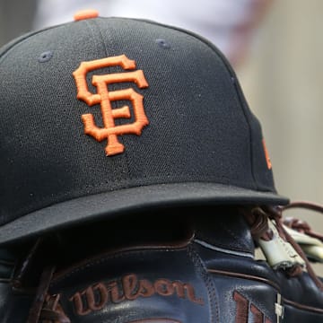 Jul 14, 2023; Pittsburgh, Pennsylvania, USA;  San Francisco Giants hat and glove on the bench against the Pittsburgh Pirates during the first inning at PNC Park. 