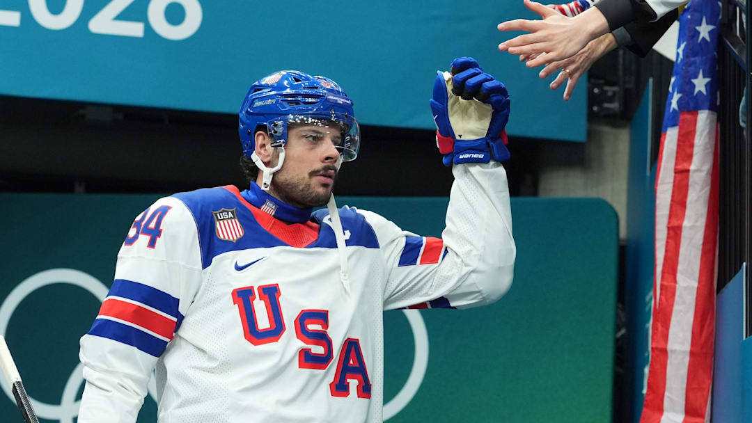 Feb 22, 2026; Milan, Italy;  Auston Matthews (34) of the United States walks to the ice for warm ups before playing against Canada in the men's ice hockey gold medal game during the Milano Cortina 2026 Olympic Winter Games at Milano Santagiulia Ice Hockey Arena. Mandatory Credit: Amber Searls-Imagn Images