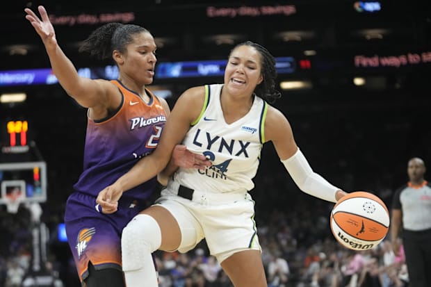 Phoenix Mercury forward Alyssa Thomas defends against Minnesota Lynx forward Napheesa Collier. 