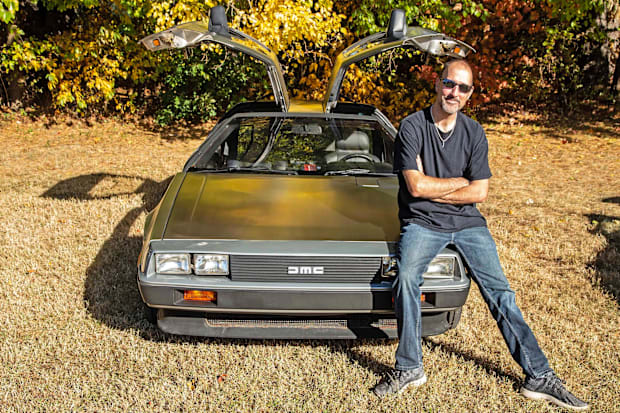 Damian Muzzi with his DeLorean DMC-12, a replica of the car from the 1985 film "Back to the Future"
