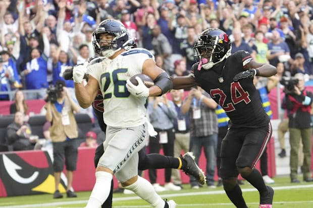 Seattle Seahawks running back Zach Charbonnet (26) runs for a touchdown against Arizona Cardinals defender Starling Thomas V.