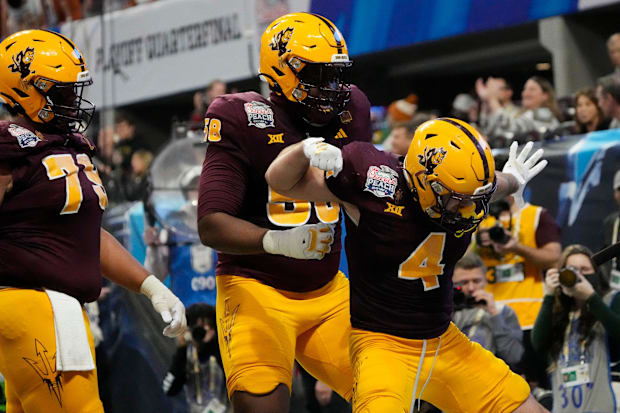 Arizona State running back Cam Skattebo (4) celebrates after a touchdown against Texas.