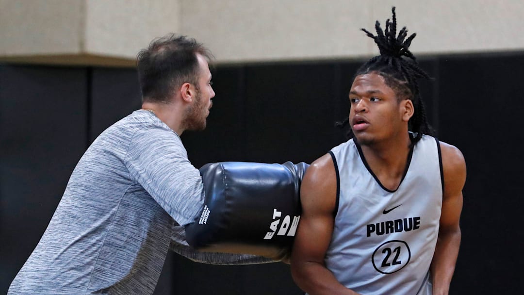 Purdue director of player development Sasha Stefanovic defends Gicarri Harris during practice, 