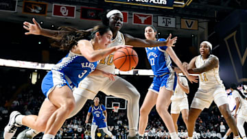 Kentucky guard Georgia Amoore (3) drives the baseline against Vanderbilt forward Jane Nwaba (10) during an NCAA college basketball game Sunday, Jan. 5, 2025, in Nashville, Tenn.