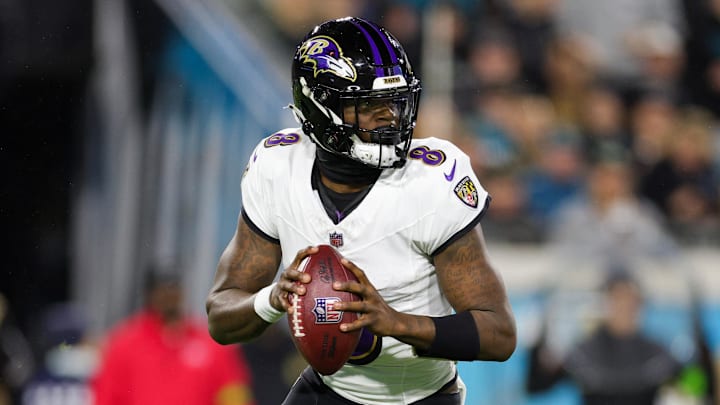 Dec 17, 2023; Jacksonville, Florida, USA;  Baltimore Ravens quarterback Lamar Jackson (8) drops back to pass against the Jacksonville Jaguars in the first quarter at EverBank Stadium. Mandatory Credit: Nathan Ray Seebeck-Imagn Images