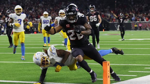 Jan 11, 2025; Houston, Texas, USA;  Houston Texans running back Joe Mixon (28) scores a touchdown against the Los Angeles Cha