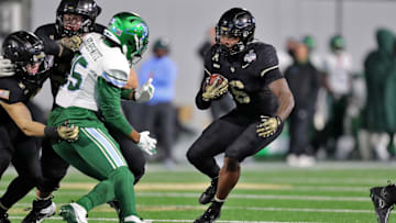 Dec 6, 2024; West Point, NY, USA; Army Black Knights running back Kanye Udoh (6) runs the ball against the Tulane Green Wave. during the first half at Michie Stadium. Mandatory Credit: Danny Wild-Imagn Images