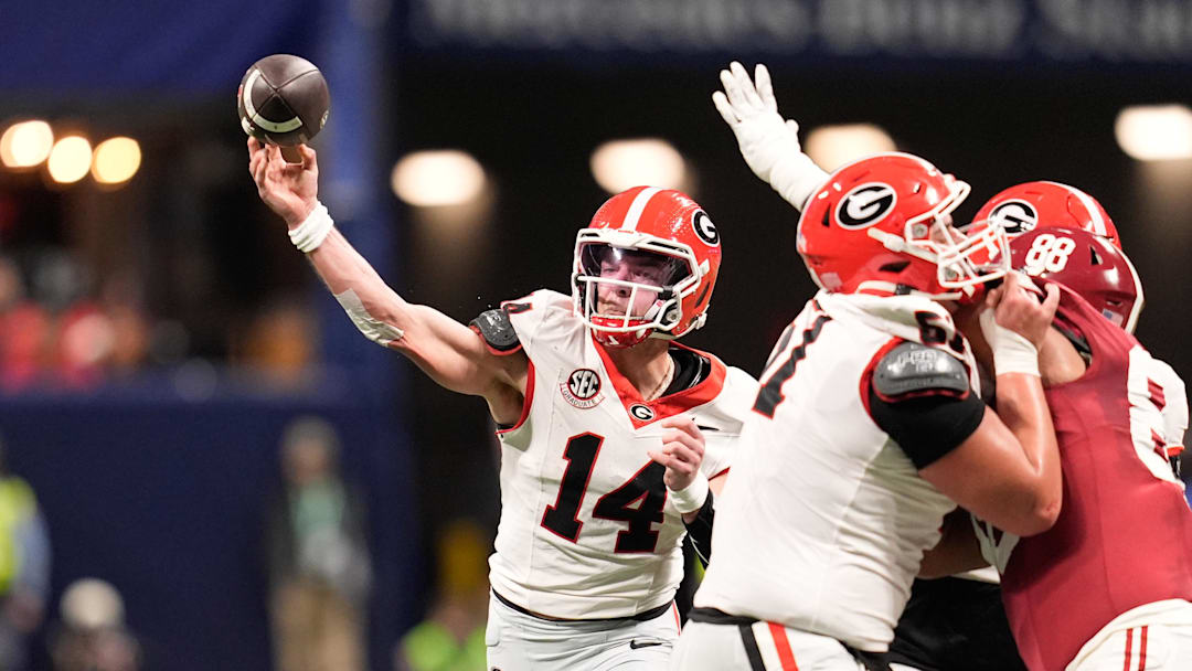 Dec 6, 2025; Atlanta, GA, USA; Georgia Bulldogs quarterback Gunner Stockton (14) throws a pass during the second quarter against the Alabama Crimson Tide during the 2025 SEC Championship game at Mercedes-Benz Stadium. Mandatory Credit: Dale Zanine-Imagn Images