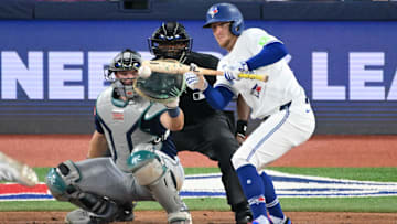 Apr 19, 2025; Toronto, Ontario, CAN;   Toronto Blue Jays center fielder Myles Straw (3) hits a sacrifice bunt to advance a runner against the Seattle Mariners in the sixth inning at Rogers Centre. Mandatory Credit: Dan Hamilton-Imagn Images