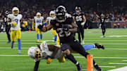 Jan 11, 2025; Houston, Texas, USA;  Houston Texans running back Joe Mixon (28) scores a touchdown against the Los Angeles Chargers in the fourth quarter in an AFC wild card game at NRG Stadium. Mandatory Credit: Thomas Shea-Imagn Images