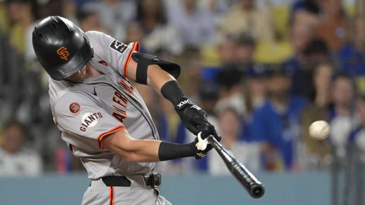 Jul 22, 2024; Los Angeles, California, USA;  San Francisco Giants third baseman Matt Chapman (26) hits a solo home run in the seventh inning against the Los Angeles Dodgers at Dodger Stadium. Mandatory Credit: Jayne Kamin-Oncea-USA TODAY Sports