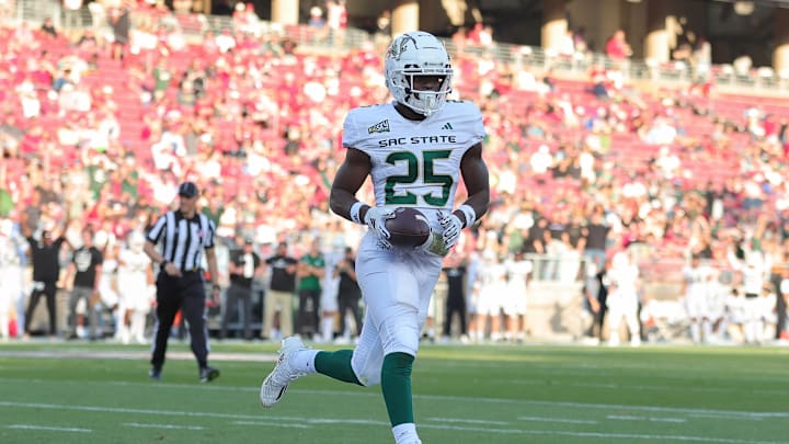 Sep 16, 2023; Stanford, California, USA; Sacramento State Hornets running back Elijah Tau-Tolliver (25) scores a touchdown during the second quarter against the Stanford Cardinal at Stanford Stadium. Mandatory Credit: Sergio Estrada-Imagn Images Sep 16, 2023; Stanford, California, USA; Sacramento State Hornets running back Elijah Tau-Tolliver (25) scores a touchdown during the second quarter against the Stanford Cardinal at Stanford Stadium. Mandatory Credit: Sergio Estrada-Imagn Images