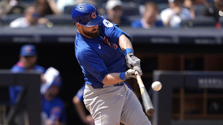 Jul 12, 2025; Bronx, New York, USA; Chicago Cubs third baseman Jon Berti (5) hits a single against the New York Yankees during the ninth inning at Yankee Stadium. 