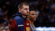 Dec 27, 2024; Denver, Colorado, USA; Denver Nuggets center Nikola Jokic (15) and guard Russell Westbrook (4) look on in the second quarter against the Cleveland Cavaliers at Ball Arena. Mandatory Credit: Isaiah J. Downing-Imagn Images